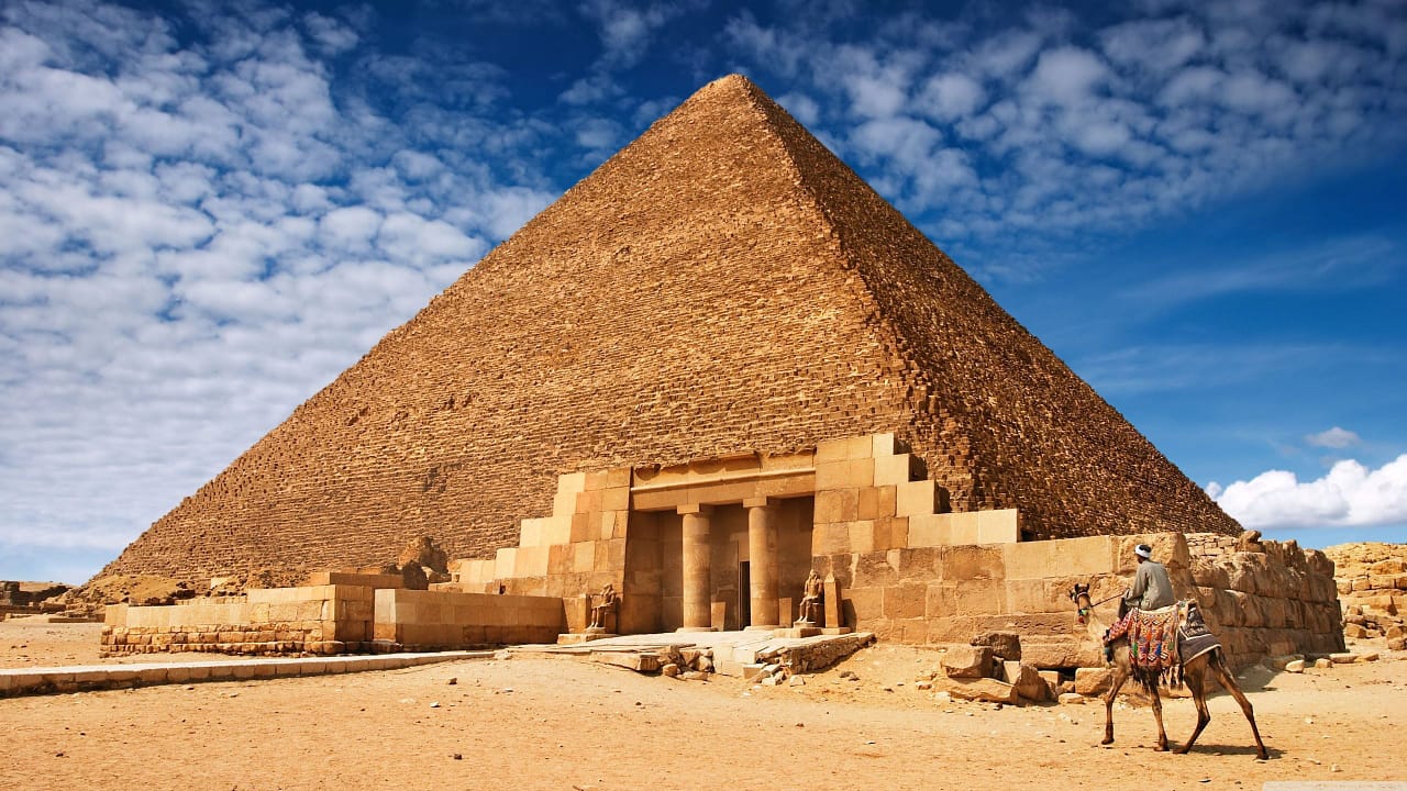 The Great Pyramid of Giza under a blue sky